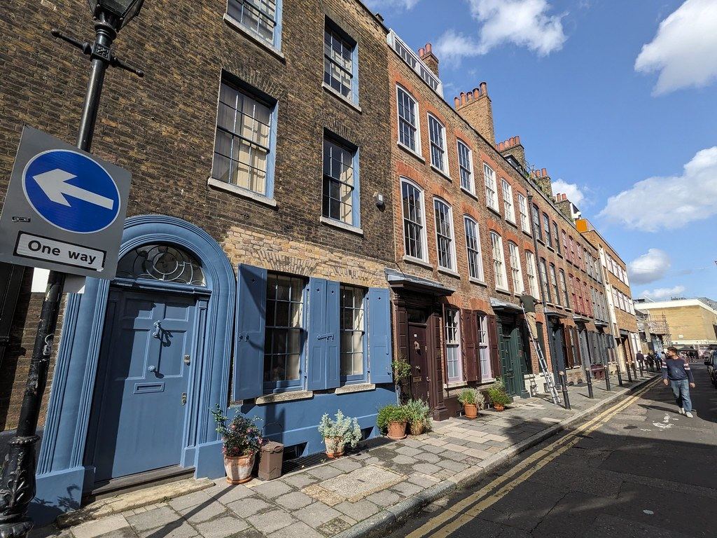 Georgian townhouses with painted front doors on a London street