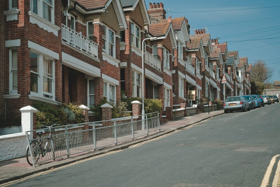 Victorian terraced houses with bay windows on a UK street